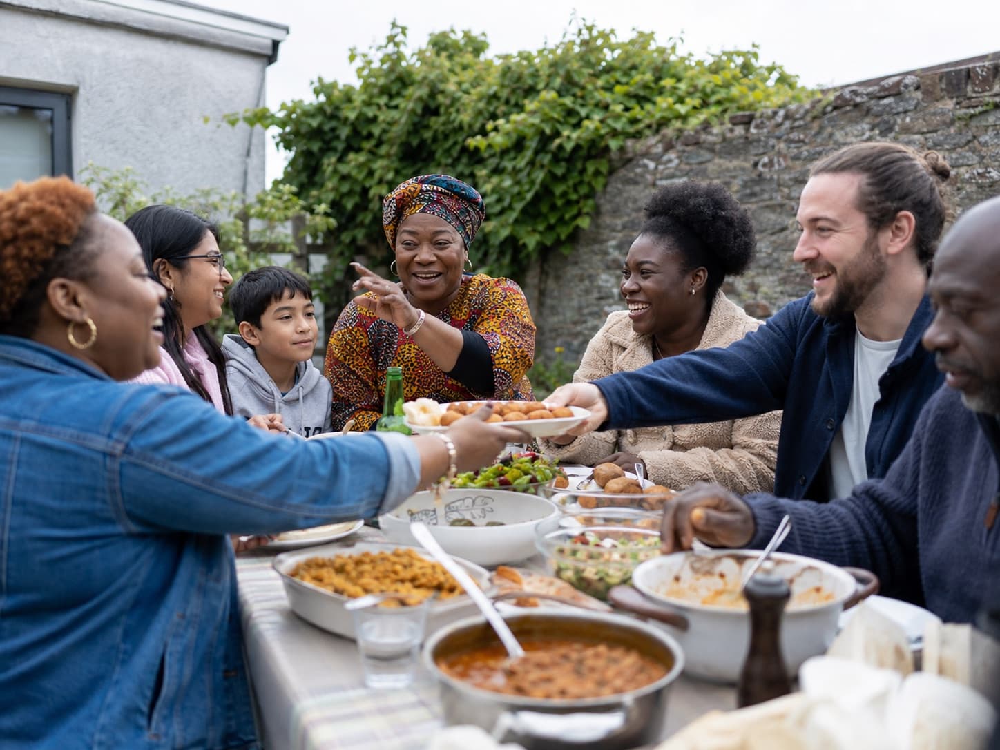 Volunteers and community members helping serve and share food together